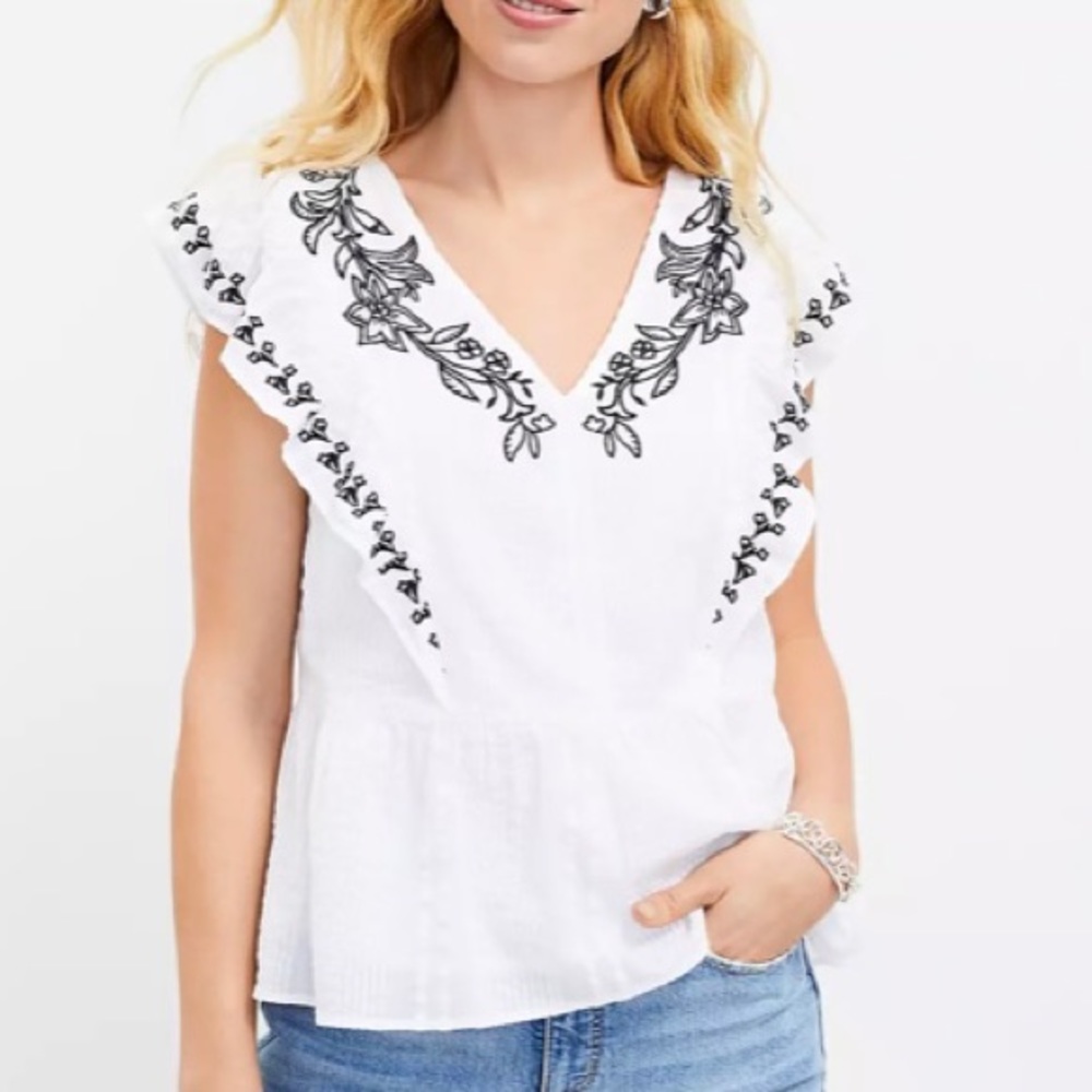 Embroidered ruffle white blouse
